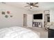 Spacious bedroom features a plush bed, a sleek TV console, and ample natural light, perfect for relaxation at 1518 Louise Ave, Auburndale, FL 33823