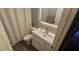 Well-lit bathroom featuring a modern vanity, a toilet, and a shower with white tile at 528 Winding Oak Ln, Longwood, FL 32750