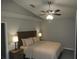 Neutral bedroom featuring lamps, a ceiling fan, and light-colored linens at 528 Winding Oak Ln, Longwood, FL 32750