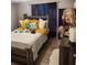 Cozy bedroom with a large bed, wood-look floors, and stylish decor at 528 Winding Oak Ln, Longwood, FL 32750