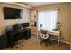 Home office featuring two workstations, wood floors, and bright natural light at 528 Winding Oak Ln, Longwood, FL 32750