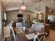 Cozy dining area open to the living room, featuring stylish decor and a welcoming ambiance at 2509 Montecito Ave, Eustis, FL 32726