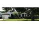 Charming single-story home featuring well-manicured landscaping and an attached two-car garage at 2509 Montecito Ave, Eustis, FL 32726
