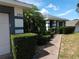 Beautiful front yard with lush greenery, a brick walkway, and a well-maintained exterior at 2509 Montecito Ave, Eustis, FL 32726