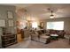 Inviting living room with cozy seating, neutral decor, and seamless flow to the dining area at 2509 Montecito Ave, Eustis, FL 32726
