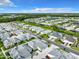 Aerial view of a neighborhood with well-maintained homes, lush landscaping, and community lakes at 198 Gypsy Palace Ln, Daytona Beach, FL 32124