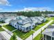 Aerial view of the neighborhood showcasing a colorful home with lush landscaping at 198 Gypsy Palace Ln, Daytona Beach, FL 32124