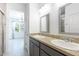 Bathroom featuring dual sinks with granite countertops and gray cabinetry at 198 Gypsy Palace Ln, Daytona Beach, FL 32124