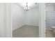 Spacious bedroom leading to bathroom features tile floors, modern lighting, and ample natural light at 198 Gypsy Palace Ln, Daytona Beach, FL 32124