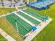 Aerial view of bocce ball courts with shaded seating areas at 198 Gypsy Palace Ln, Daytona Beach, FL 32124