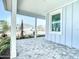 The home's covered carport shows stone pavers and supports, offering a view of the neighborhood at 198 Gypsy Palace Ln, Daytona Beach, FL 32124