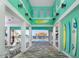 Stylish clubhouse interior with a view of the pool and beachy decor at 198 Gypsy Palace Ln, Daytona Beach, FL 32124