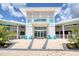 View of the community clubhouse with bright blue signage and adirondack chairs at 198 Gypsy Palace Ln, Daytona Beach, FL 32124