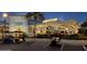 Exterior of 'Latitude Bar & Chill' with golf carts parked in front and inviting lights and signage at 198 Gypsy Palace Ln, Daytona Beach, FL 32124