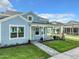 Charming home featuring blue siding, a landscaped yard, and a covered front porch at 198 Gypsy Palace Ln, Daytona Beach, FL 32124