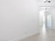 Bright hallway with tiled flooring and access to multiple rooms with modern lighting at 198 Gypsy Palace Ln, Daytona Beach, FL 32124