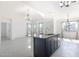 Bright kitchen featuring a center island with granite countertop, stainless steel dishwasher, and an open floorplan at 198 Gypsy Palace Ln, Daytona Beach, FL 32124