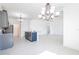 Open-concept kitchen with island, granite countertops, stainless steel appliances, and modern lighting at 198 Gypsy Palace Ln, Daytona Beach, FL 32124
