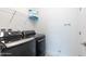 Well-equipped laundry room with modern washer, dryer, shelving and storage at 198 Gypsy Palace Ln, Daytona Beach, FL 32124