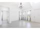 Bright living room with tile floors, large windows, modern lighting, and neutral decor at 198 Gypsy Palace Ln, Daytona Beach, FL 32124