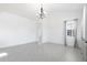 Expansive living area with tile floors, soaring ceilings, and abundant natural light through large windows at 198 Gypsy Palace Ln, Daytona Beach, FL 32124