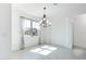Bright living room with a large window covered in white curtains providing natural light and neutral wall color at 198 Gypsy Palace Ln, Daytona Beach, FL 32124