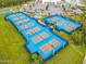 Aerial view of well-maintained pickleball courts surrounded by lush landscaping at 198 Gypsy Palace Ln, Daytona Beach, FL 32124