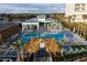 Resort-style pool area with tiki bars, lounge chairs, and lush landscaping for relaxation at 198 Gypsy Palace Ln, Daytona Beach, FL 32124