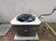 Exterior view showing the Bryant branded air conditioner unit on a concrete pad at 606 Carrigan Woods Trl, Oviedo, FL 32765