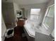 Bathroom with a large tub and a sink with a window and a closet door at 606 Carrigan Woods Trl, Oviedo, FL 32765