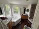 Bathroom with a large tub under a window, a sink, and a walk-in shower at 606 Carrigan Woods Trl, Oviedo, FL 32765
