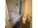 Bathroom features a shower and tub combination with toilet and basic fixtures at 606 Carrigan Woods Trl, Oviedo, FL 32765