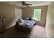 Bedroom with neutral colored walls and carpet and a window and a ceiling fan at 606 Carrigan Woods Trl, Oviedo, FL 32765