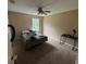 Bedroom with neutral colored walls and carpet and a window and a ceiling fan at 606 Carrigan Woods Trl, Oviedo, FL 32765