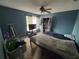Cozy bedroom with ceiling fan, closet, and window offers comfortable space at 606 Carrigan Woods Trl, Oviedo, FL 32765