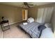 Bedroom with neutral colored walls and carpet and a window and a ceiling fan at 606 Carrigan Woods Trl, Oviedo, FL 32765