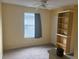 Bedroom with carpet floors, window, and custom shelving at 606 Carrigan Woods Trl, Oviedo, FL 32765
