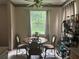 A dining area with a large window offering natural light and outdoor views at 606 Carrigan Woods Trl, Oviedo, FL 32765