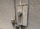 Close up of the electrical box on the exterior wall of the house at 606 Carrigan Woods Trl, Oviedo, FL 32765