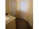 Hallway with light yellow walls and brown carpet and white doors at 606 Carrigan Woods Trl, Oviedo, FL 32765