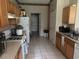 Kitchen with tile flooring, ample cabinetry, and white appliances at 606 Carrigan Woods Trl, Oviedo, FL 32765