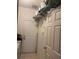A laundry room with lots of storage, a washing machine and access to the yard at 606 Carrigan Woods Trl, Oviedo, FL 32765