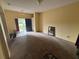 Spacious living room with neutral carpet and view of the front entry at 606 Carrigan Woods Trl, Oviedo, FL 32765