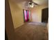 An empty living room with neutral carpet, light walls, and natural light at 606 Carrigan Woods Trl, Oviedo, FL 32765