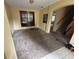 Living room featuring neutral carpet, light-colored walls, staircase and natural light at 606 Carrigan Woods Trl, Oviedo, FL 32765
