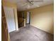 Cozy loft area with carpet flooring and a ceiling fan at 606 Carrigan Woods Trl, Oviedo, FL 32765