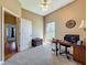 Light-filled bedroom with neutral colors, a ceiling fan, and a view to the outdoors at 10222 Rockridge Rd, Lakeland, FL 33810