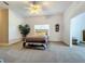 Main bedroom featuring carpet floors, ceiling fan, and bright natural light at 10222 Rockridge Rd, Lakeland, FL 33810