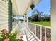 Inviting front porch with rocking chairs overlooking a spacious lawn at 10222 Rockridge Rd, Lakeland, FL 33810