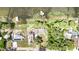 Aerial view of waterfront homes with docks and lush greenery at 1149 Shady Cove E Rd, Haines City, FL 33844
